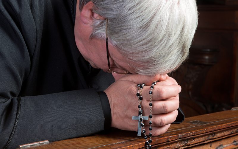 Priest praying