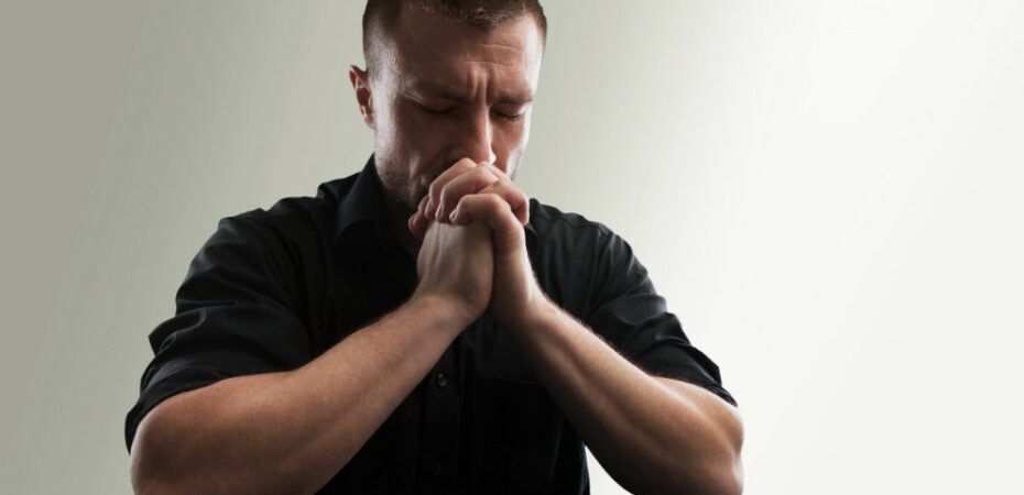 man prays