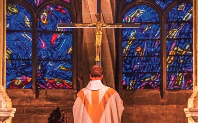 priest prays