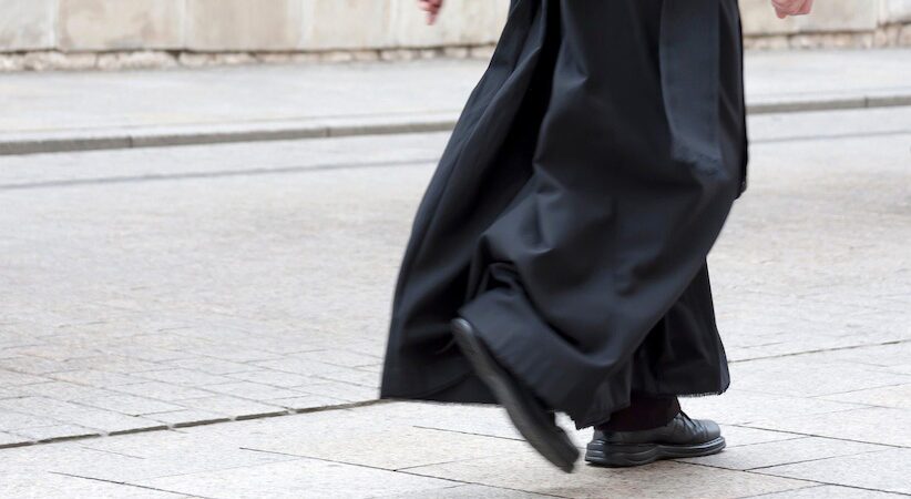 priest walking
