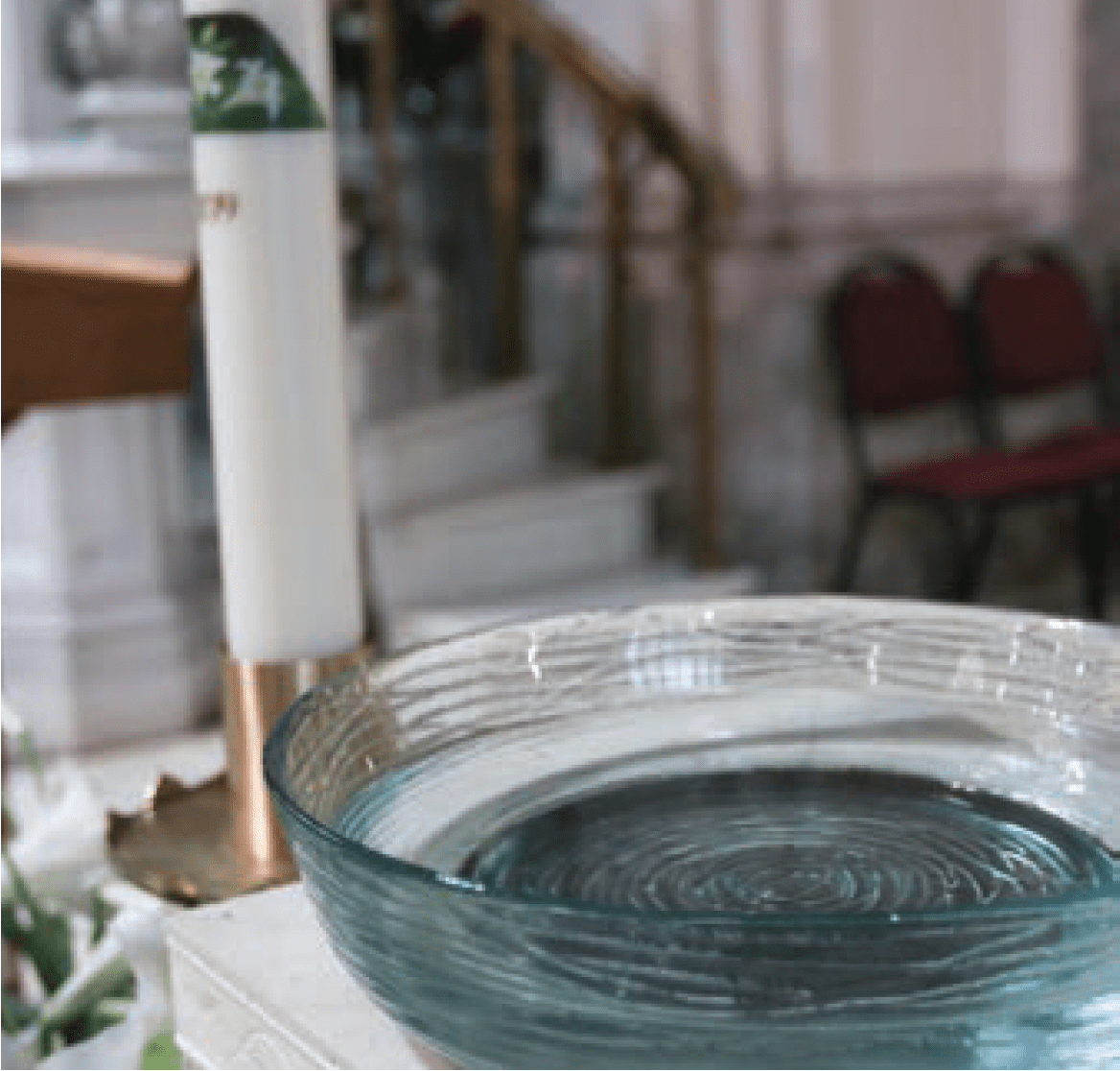 Baptismal font and Paschal candle.