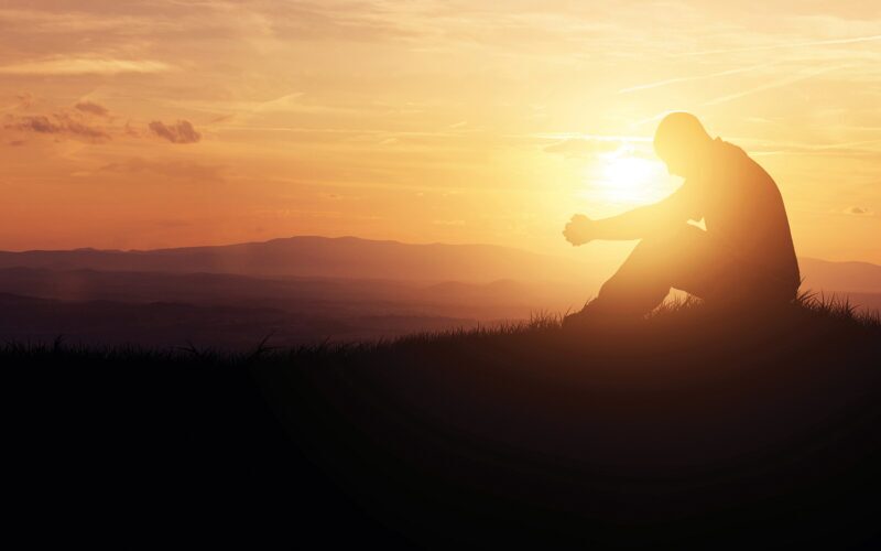 man prays