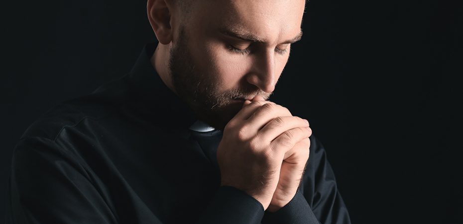 priest prays