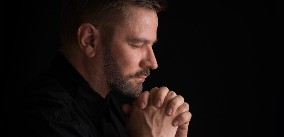 priest prays