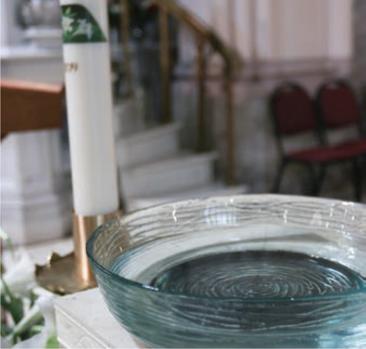 Baptismal font and Paschal candle. 